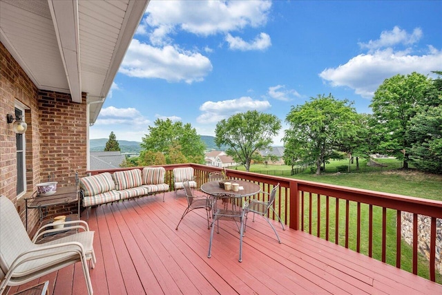 wooden terrace with a yard
