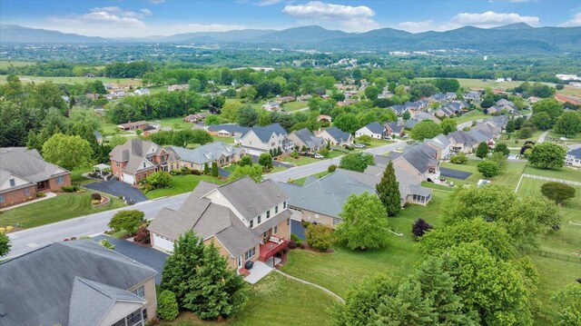 aerial view of residential area featuring a mountain backdrop
