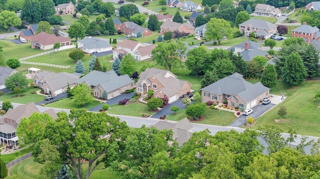 aerial view of property and surrounding area with nearby suburban area