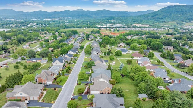aerial view of residential area with a mountain backdrop