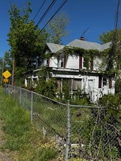 view of property exterior with fence