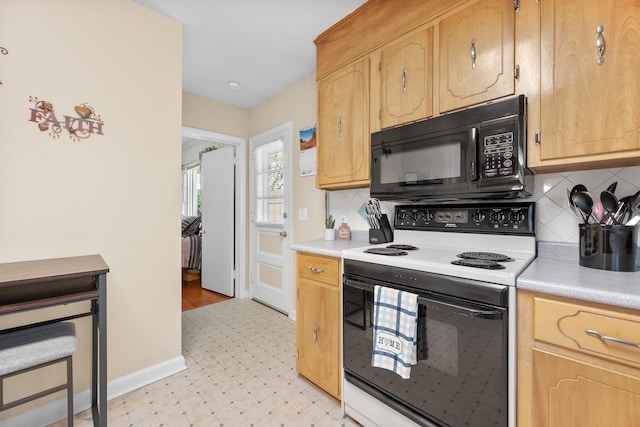 kitchen with electric range, black microwave, tasteful backsplash, light countertops, and light floors
