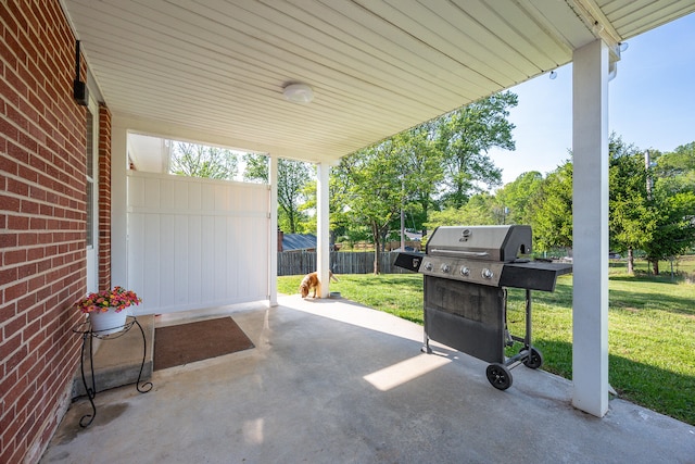 view of patio with fence and area for grilling