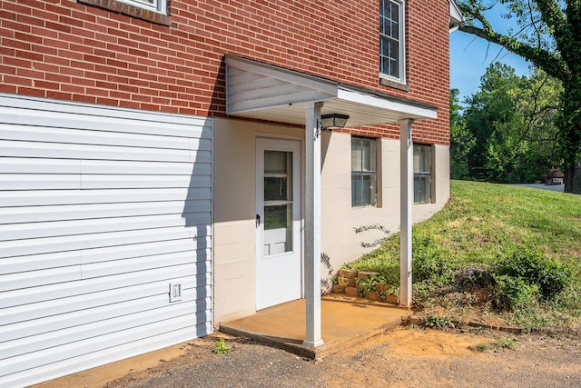entrance to property with brick siding