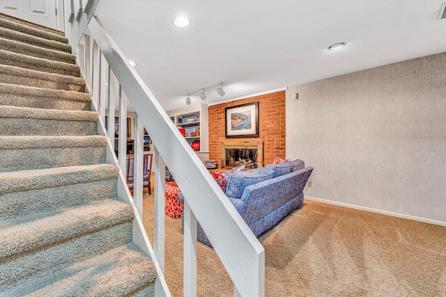 835 Wildwood Rd SW, Roanoke, VA 24014 - staircase featuring carpet, a brick fireplace, baseboards, and recessed lighting