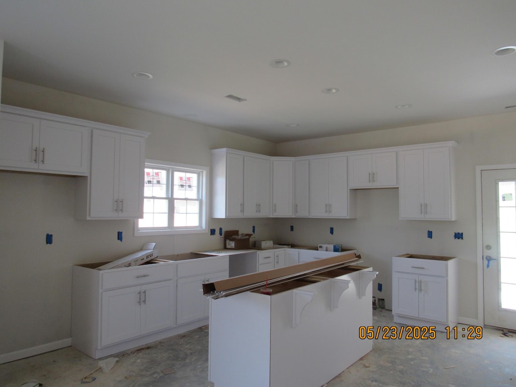 5510 New Pleasant Way, Salem, VA 24153 - kitchen featuring a center island, white cabinets, and baseboards