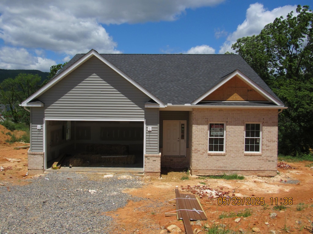 5508 Old Grove Ln, Salem, VA 24153 - view of front of house featuring brick siding, driveway, a garage, and a shingled roof