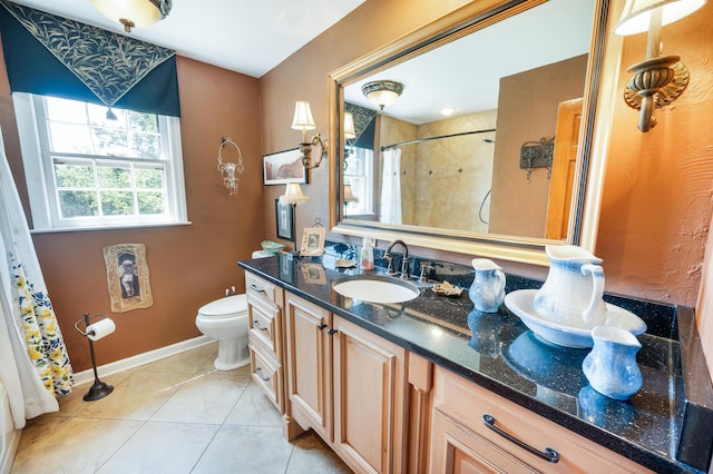 full bath featuring tile patterned flooring, vanity, toilet, baseboards, and curtained shower