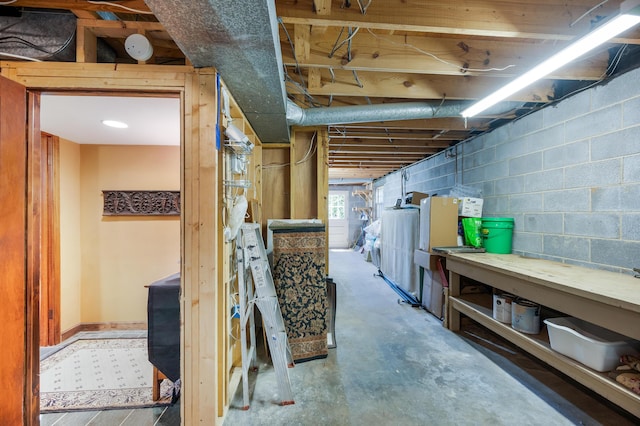 below grade area featuring concrete block wall