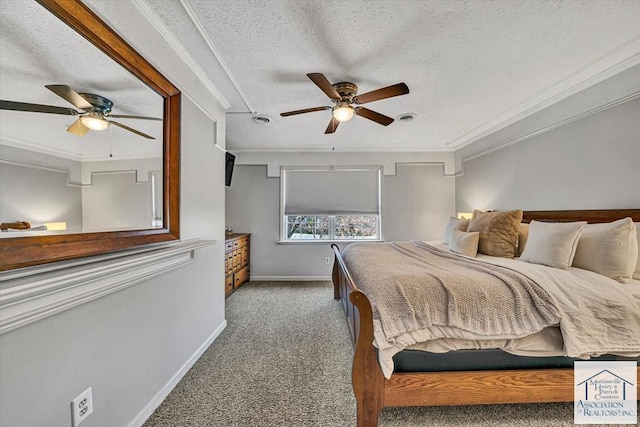 bedroom with a textured ceiling, visible vents, carpet floors, baseboards, and ornamental molding