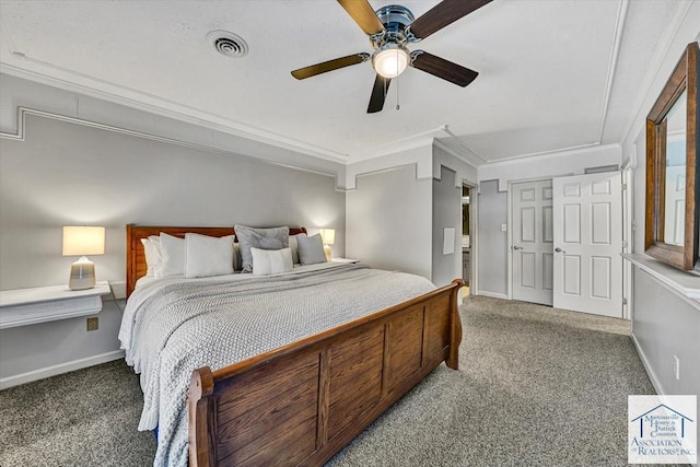 bedroom with carpet flooring, crown molding, visible vents, and baseboards