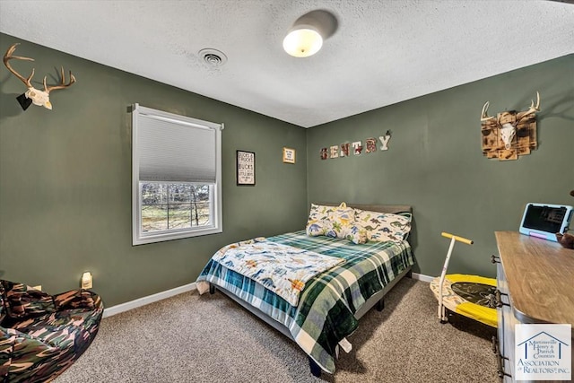 bedroom featuring baseboards, carpet flooring, a textured ceiling, and visible vents
