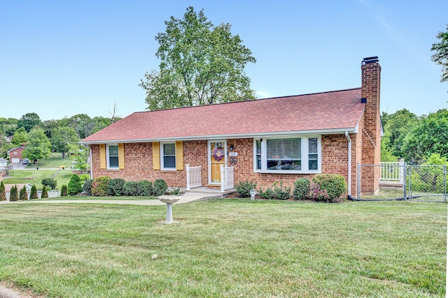 single story home with a chimney, a front yard, brick siding, fence, and a shingled roof