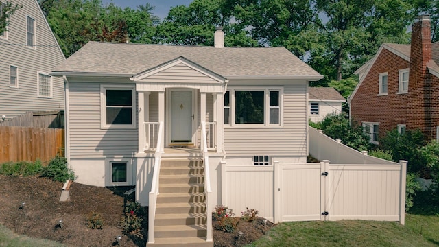 2509 Sweetbrier Ave SW, Roanoke, VA 24015 - bungalow-style home featuring a chimney, a gate, fence private yard, stairway, and a shingled roof