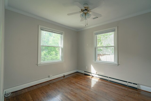 2509 Sweetbrier Ave SW, Roanoke, VA 24015 - empty room with crown molding, ceiling fan, a wealth of natural light, and wood finished floors