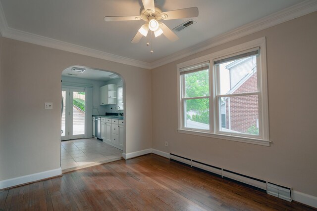 2509 Sweetbrier Ave SW, Roanoke, VA 24015 - empty room with arched walkways, light wood-style flooring, baseboards, visible vents, and ornamental molding