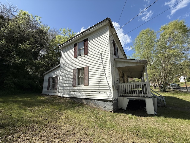 view of property exterior with a yard