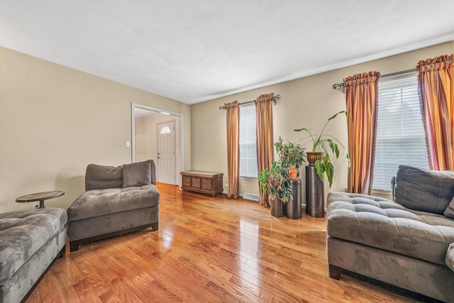 living area with plenty of natural light and light wood finished floors