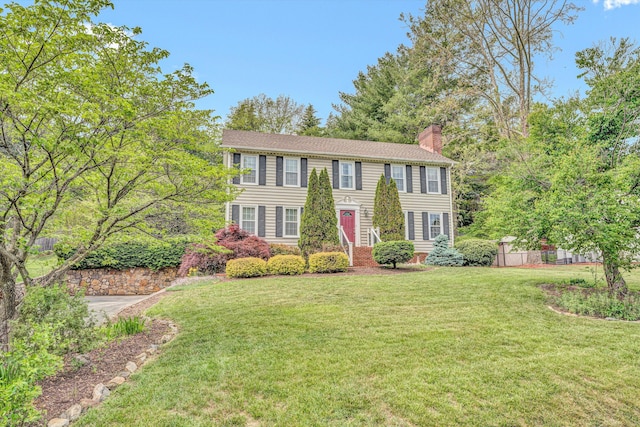 colonial-style house with a chimney