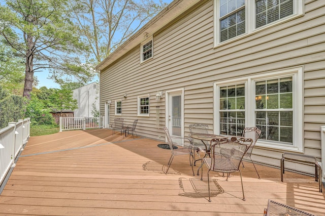wooden deck with outdoor dining space