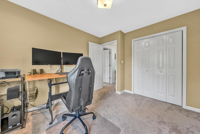 carpeted office space with baseboards