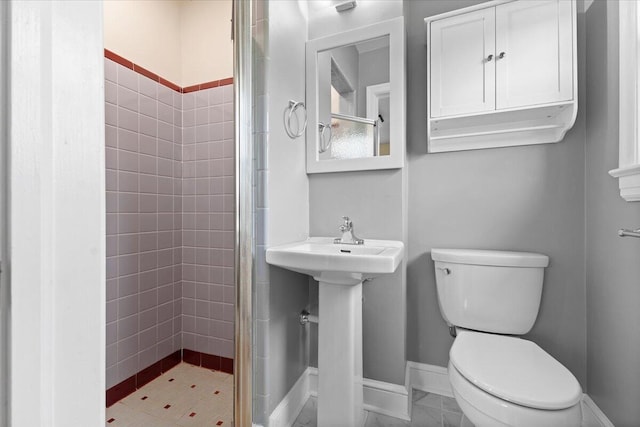 2738 Thorndale St SW, Roanoke, VA 24015 - bathroom featuring toilet, a stall shower, and baseboards