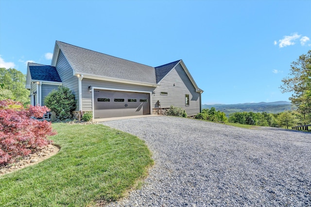890 Blain Rd, Buchanan, VA 24066 - view of property exterior featuring driveway, an attached garage, a shingled roof, and a lawn