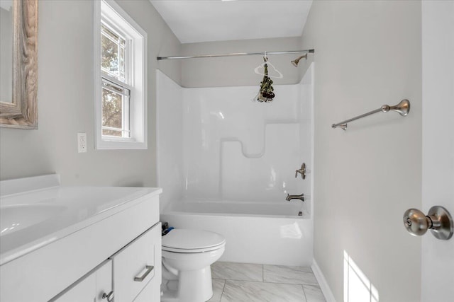 full bath with shower / bathing tub combination, vanity, baseboards, toilet, and marble finish floor