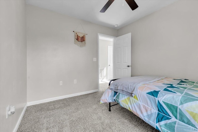 bedroom featuring carpet floors, a ceiling fan, and baseboards