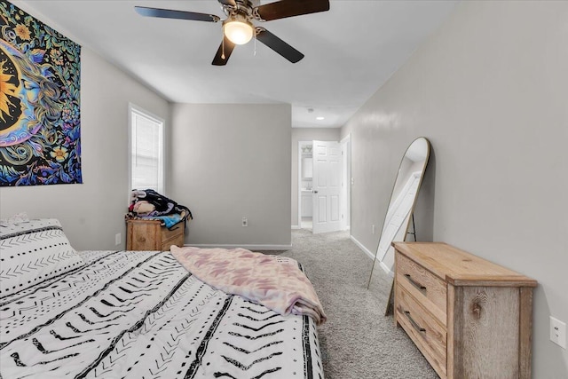 carpeted bedroom with baseboards and a ceiling fan