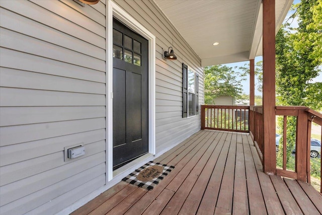 wooden deck featuring covered porch