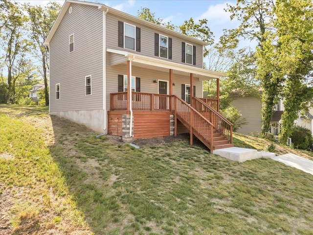 view of front of property with covered porch, stairway, and a front yard