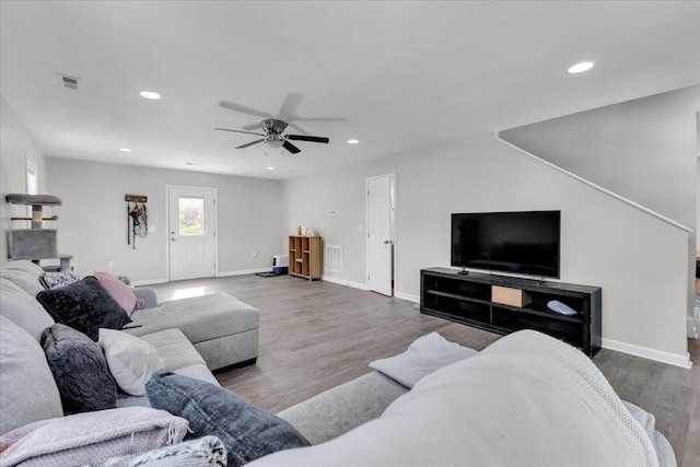 living area featuring recessed lighting, a ceiling fan, and visible vents