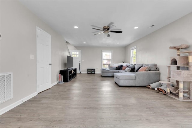 living area featuring visible vents, recessed lighting, ceiling fan, and wood finished floors