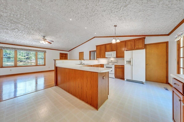 kitchen featuring crown molding, a sink, light countertops, light floors, and white appliances