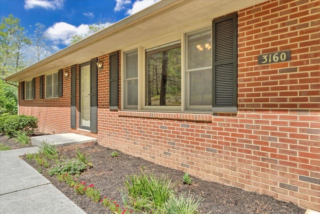 entrance to property with brick siding