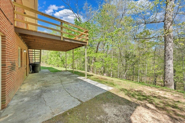 exterior space with a carport and a deck