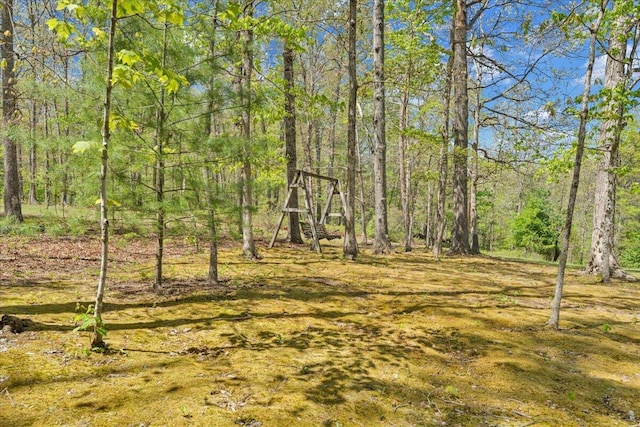 view of yard with a forest view