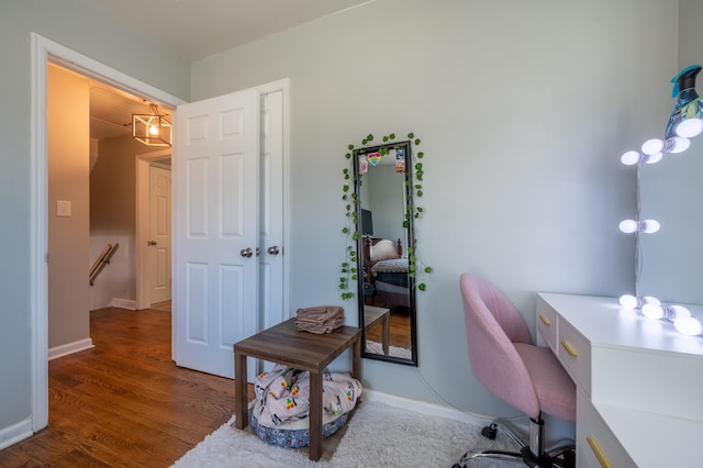 home office with wood finished floors and baseboards