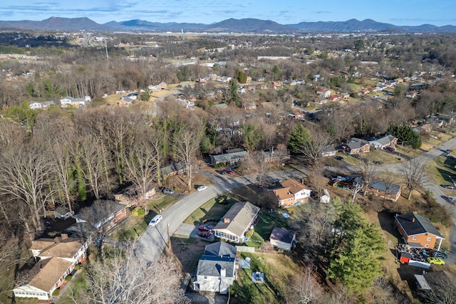 aerial view of property and surrounding area with a mountainous background