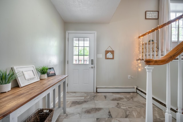 entryway featuring light marble finish flooring, baseboard heating, stairway, and a textured ceiling
