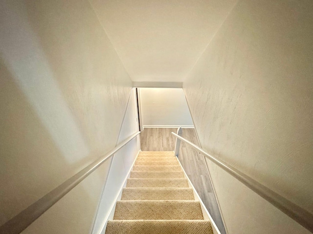 stairs with wood finished floors