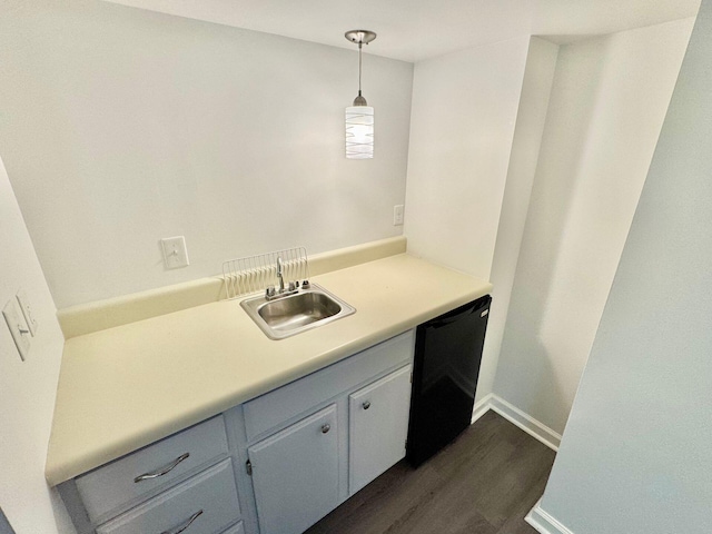 bathroom with vanity, baseboards, and wood finished floors