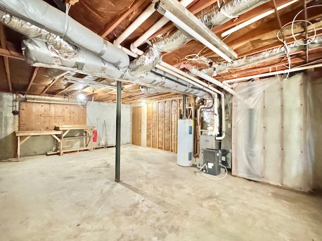 unfinished basement featuring water heater and heating unit