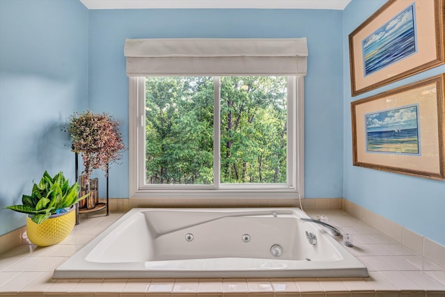 bathroom with a jetted tub and a wealth of natural light