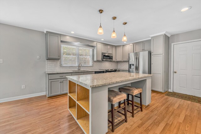 kitchen featuring appliances with stainless steel finishes and gray cabinetry