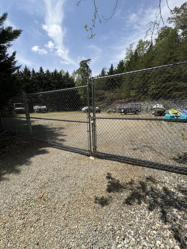 view of gate featuring fence
