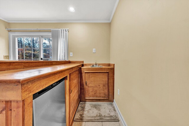 bar featuring stainless steel fridge, ornamental molding, baseboards, and a sink