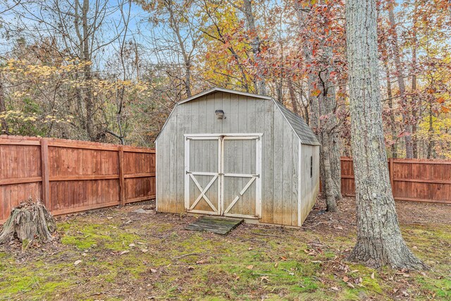 view of shed with a fenced backyard