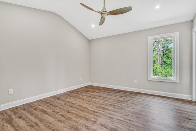 unfurnished room with baseboards, ceiling fan, and wood finished floors